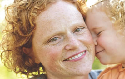 Mother holding daughter