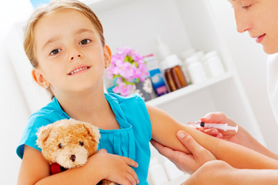 Little girl getting a shot